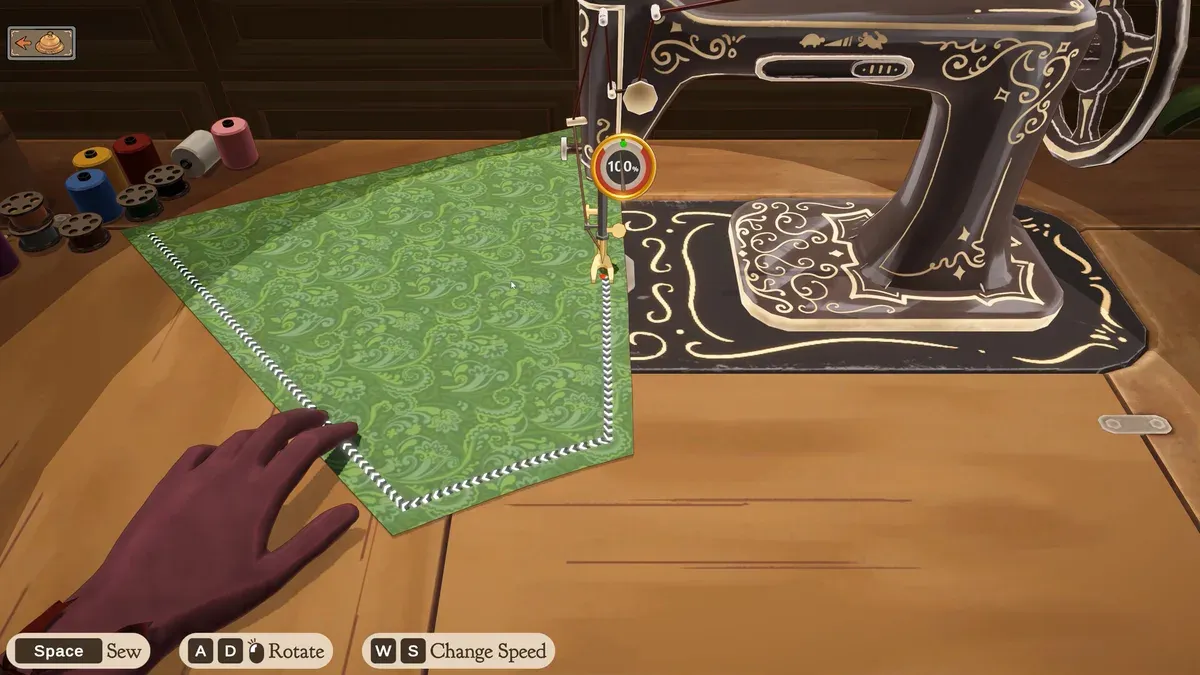 Dressmaker sewing scene with spools, seam route and Space, A/D and W/S prompts